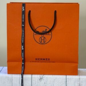 Hermès Signature Orange shopping bag with ribbon